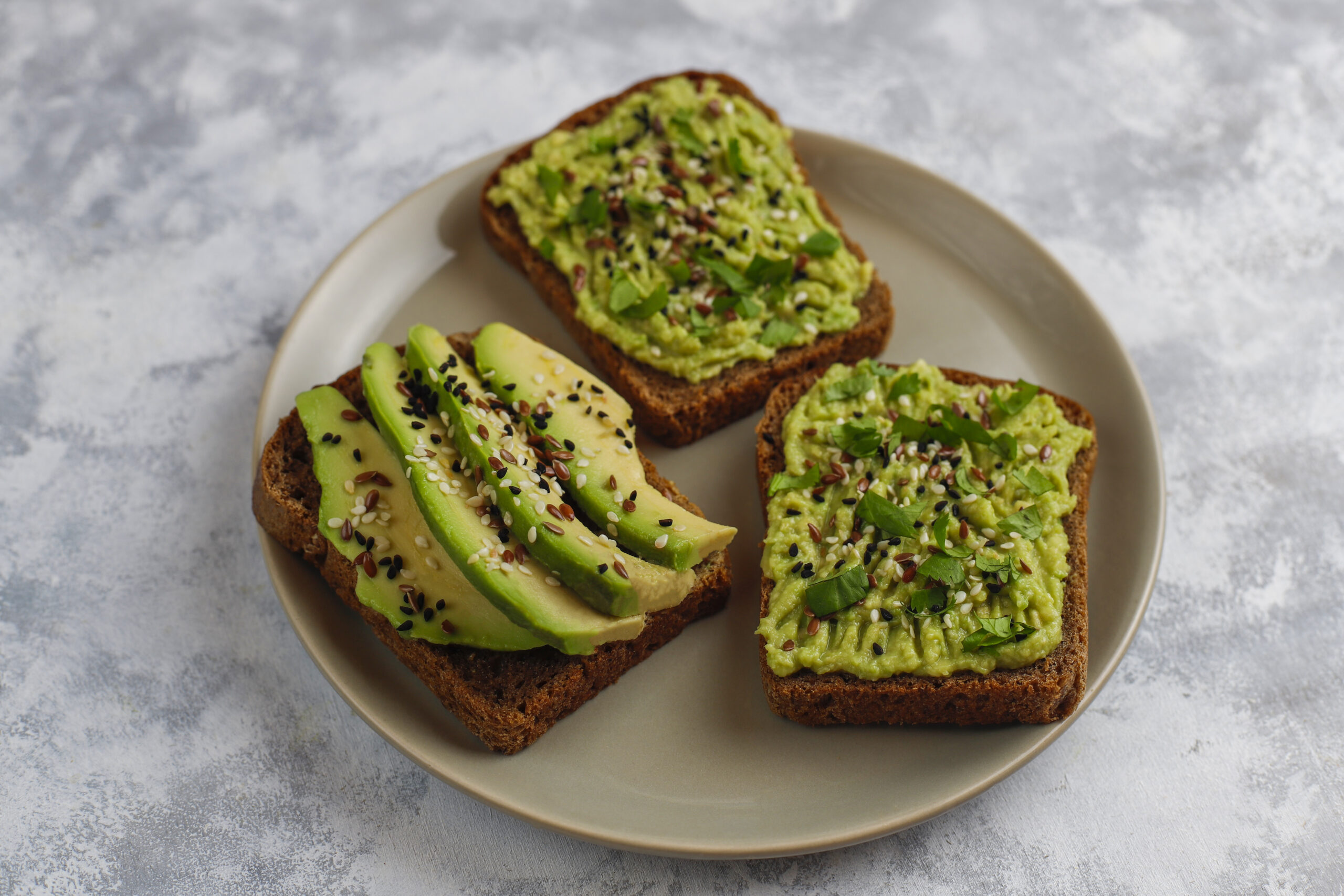 avocado open toast with avocado slices,lemon,flax seeds,sesame s